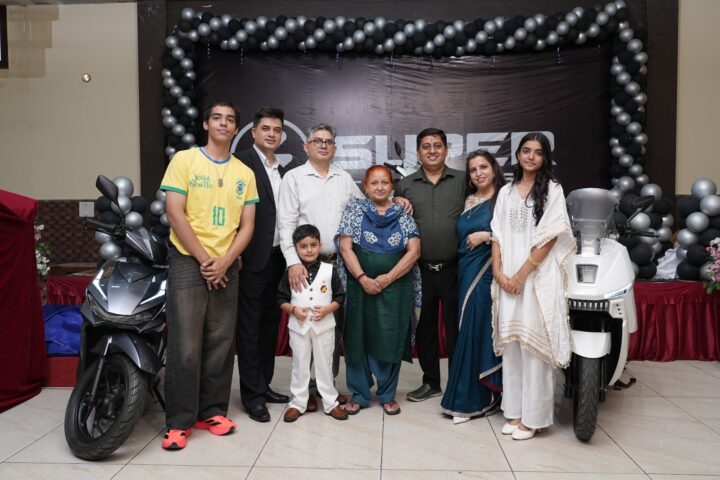 Launch event of Super Motors EV in Jammu showcasing electric scooters.